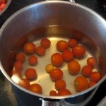 Simmer tomatoes to split skins