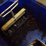 Filling the soil block maker