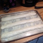 Shaped loaves on baking sheet